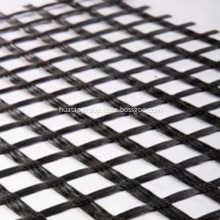 Fiberglass geogrid reinforced composite nonwoven geotextile